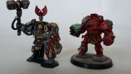 The red chap was my first attempt at painting Blood Angels. It wasn't very successful, so I have rechristened him a Techmarine in Terminator armour.